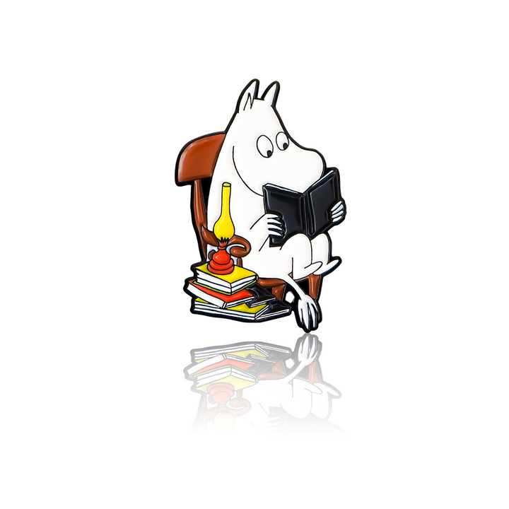 Moomintroll reading a book